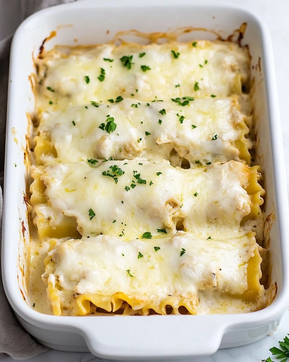 Chicken Alfredo Lasagna Rolls, creamy lasagna roll ups, easy chicken lasagna recipe, cheesy Alfredo stuffed pasta, comforting baked lasagna rolls