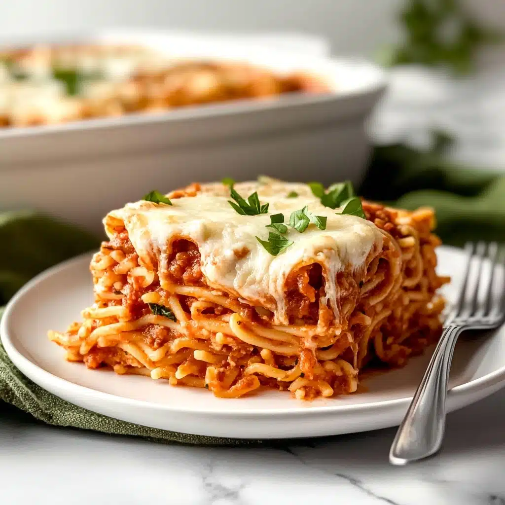 Baked Spaghetti with Cream Cheese, creamy baked spaghetti recipe, cheesy casserole with cream cheese, comfort food pasta dish, easy baked spaghetti ideas